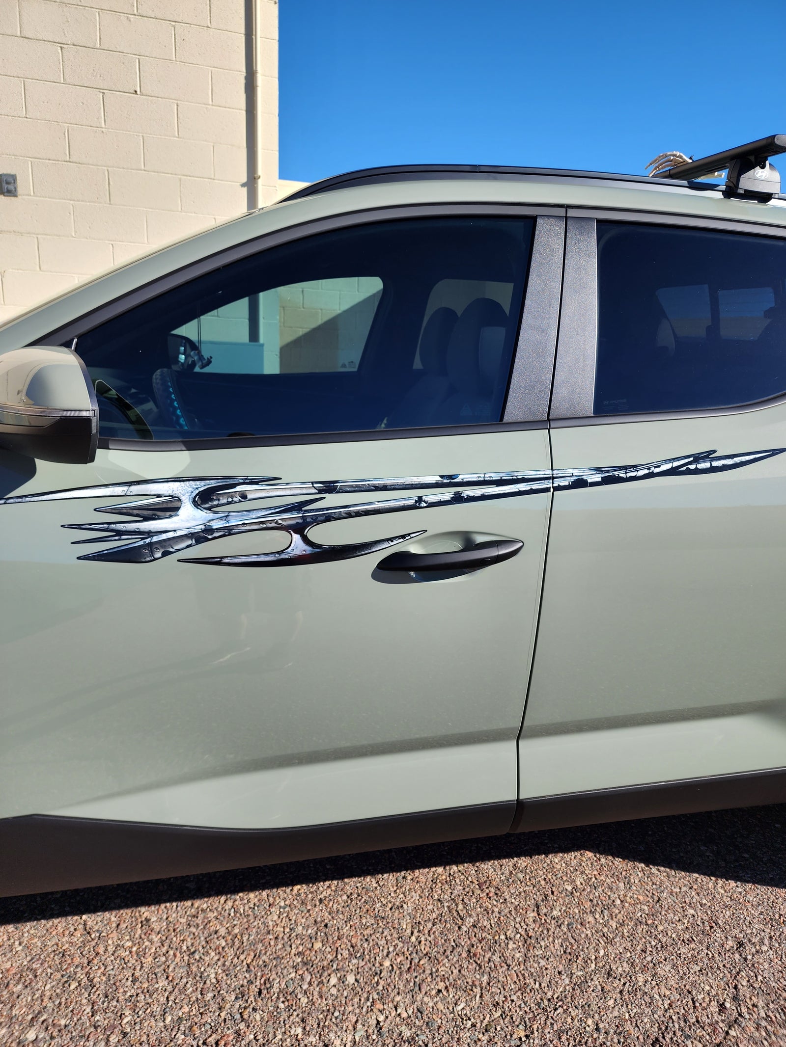 Tribal edge vinyl graphics ont he side of hyundai truck