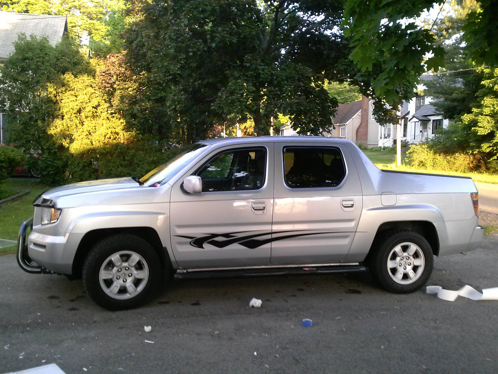 Black vinyl decal stripes on silver honda ridgeline pickup truck