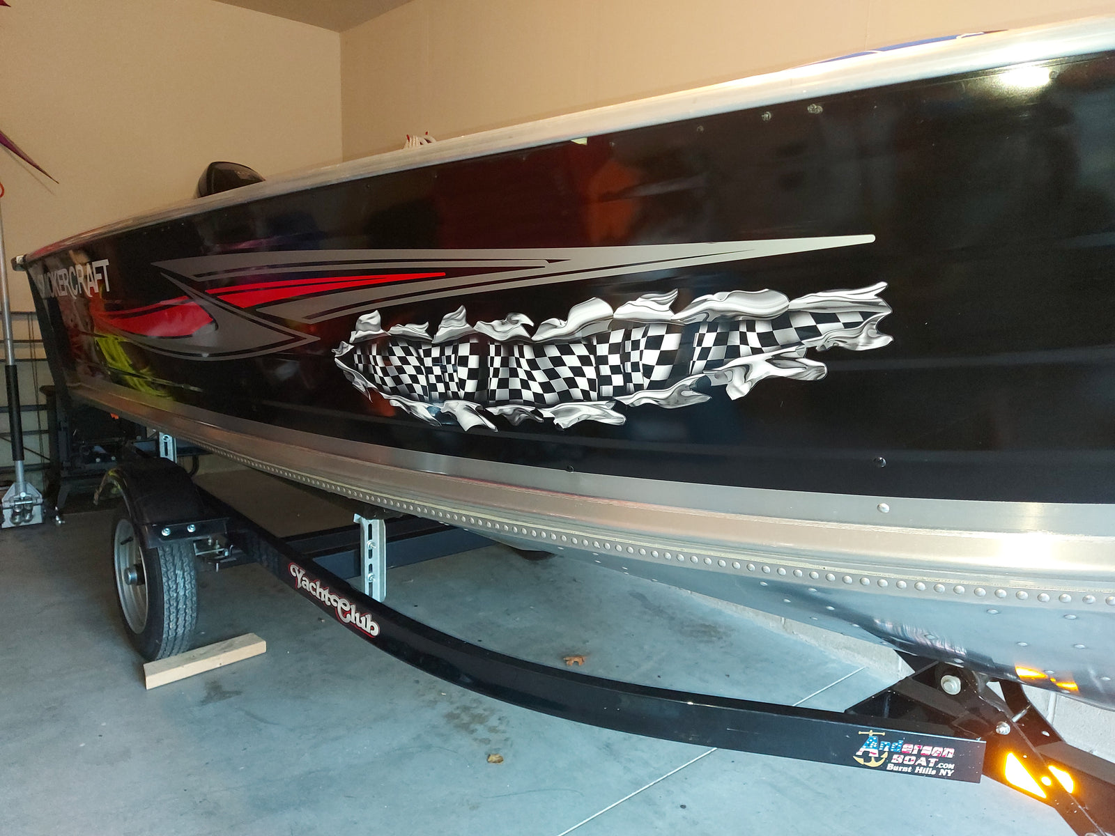 Checkered flag tear decal on boat