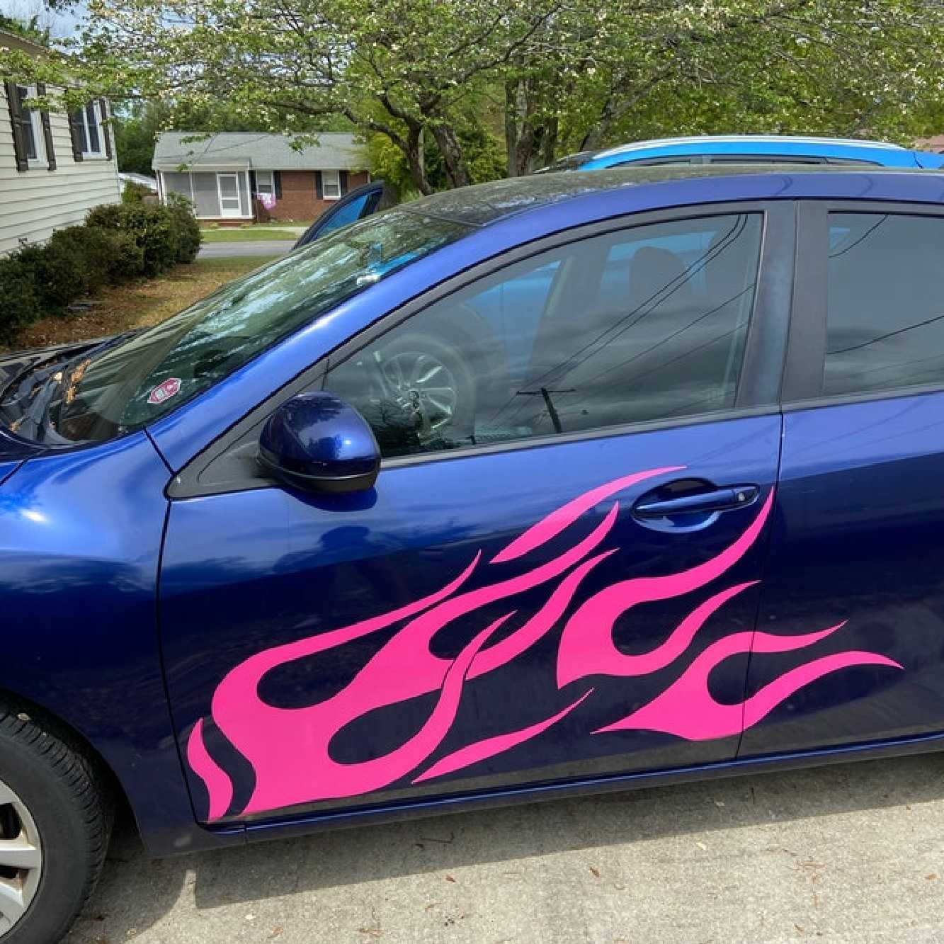 Flame decals on side of car