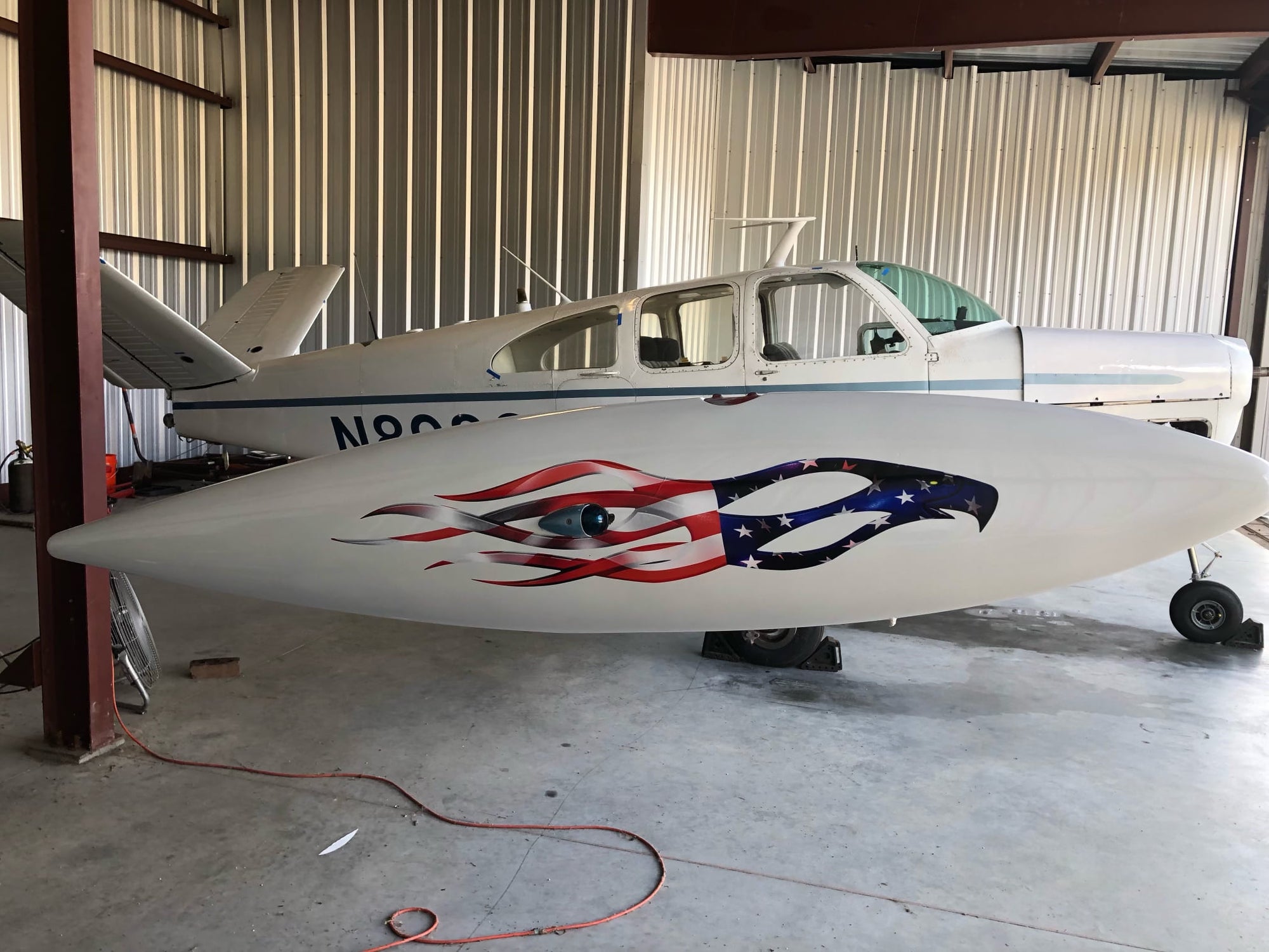 american flag eagle decals on side of a white plane