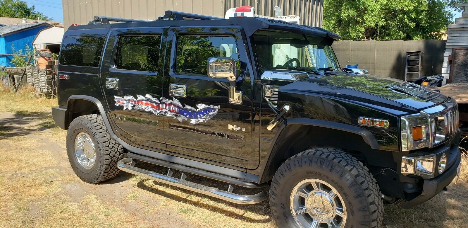 american flag tear decal on a black H2 hummer
