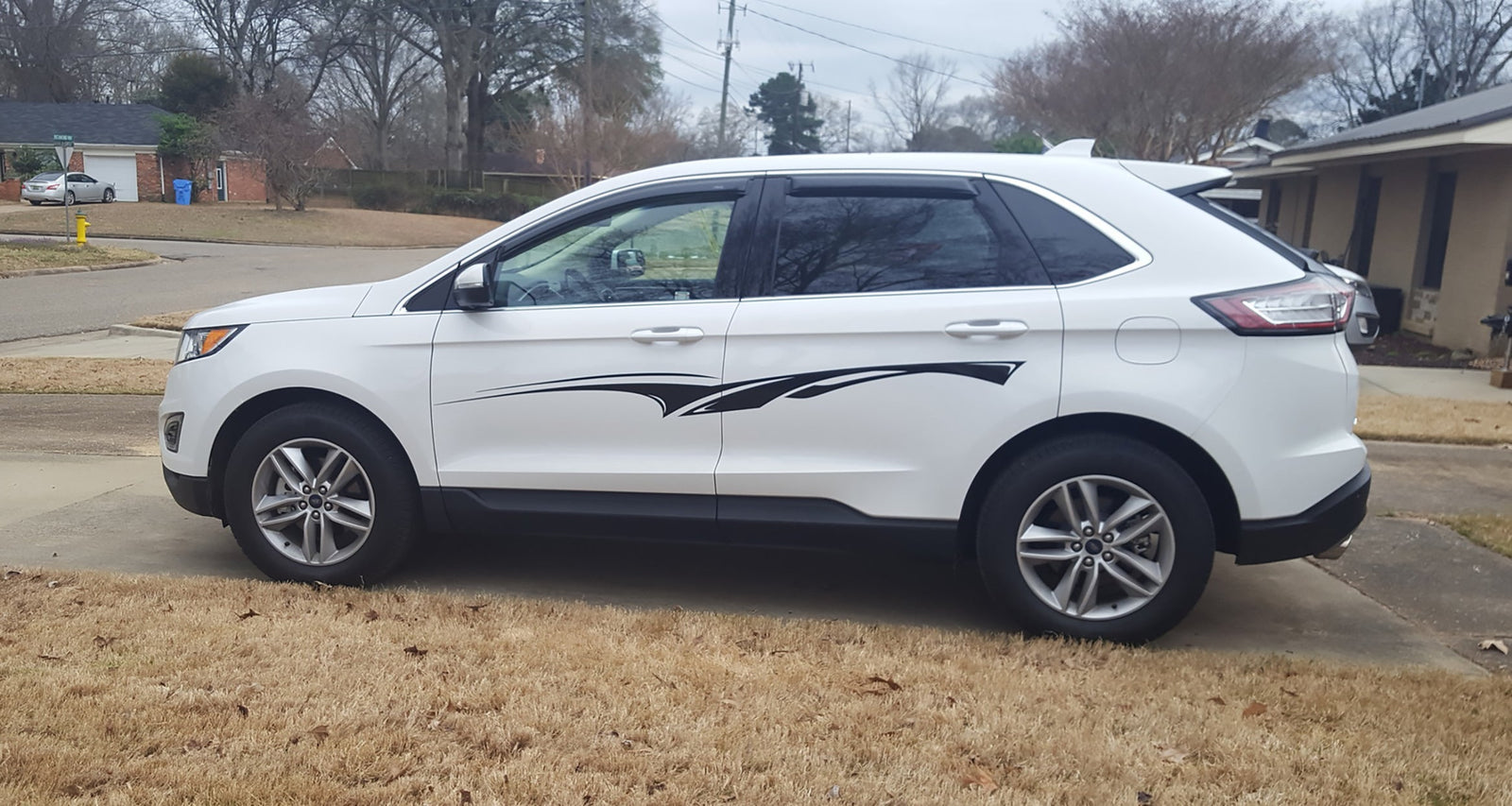 Black vinyl side stripe decal installed on a white SUV – customer photo