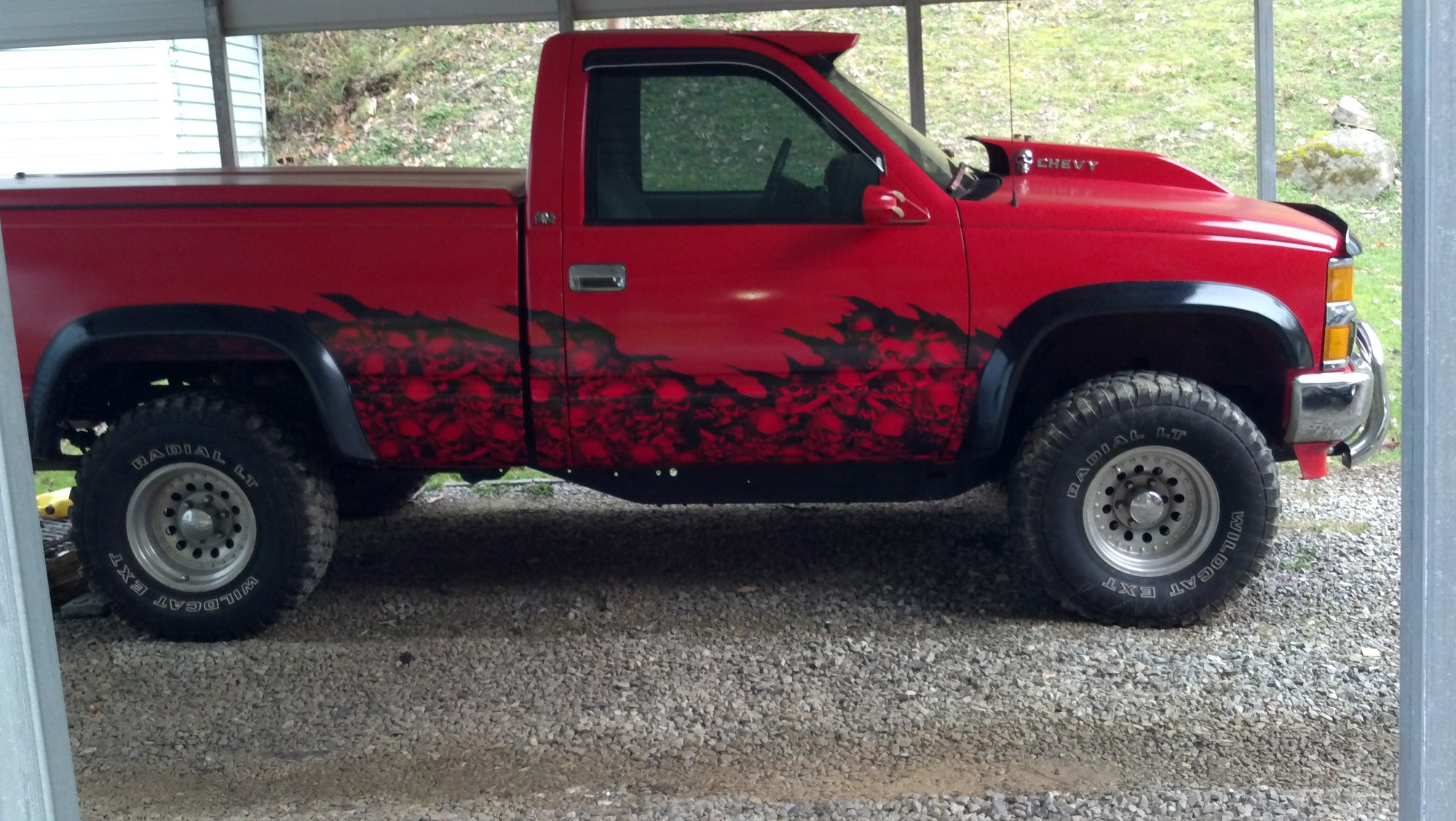 skull wave decal wrap on red chevy truck