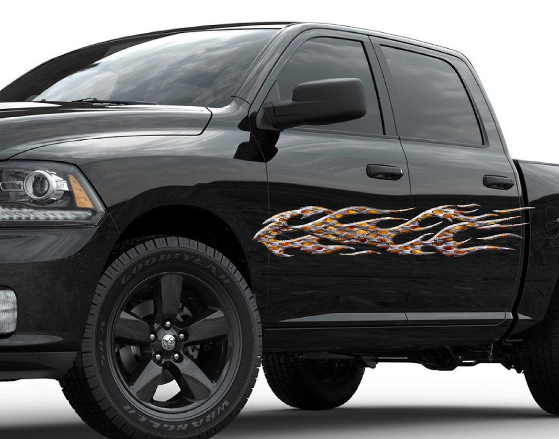black pick up truck with a barb wire flames decal