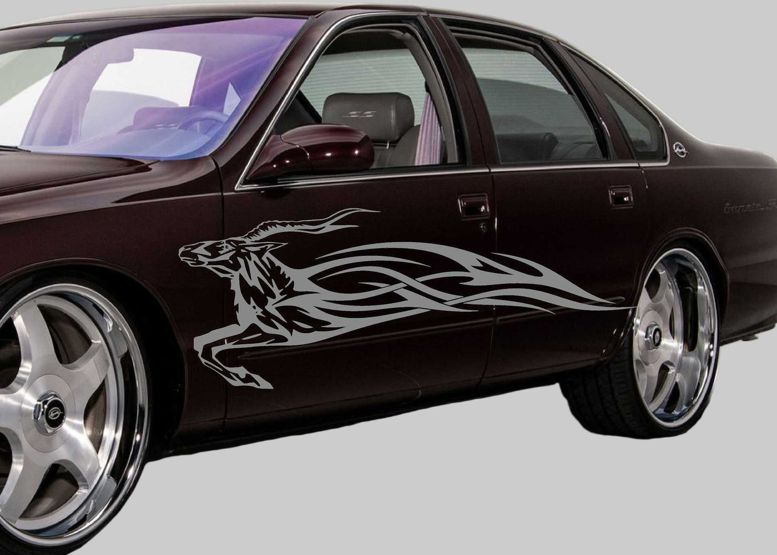 96 chevy impala with silver impala flames decal on driver side