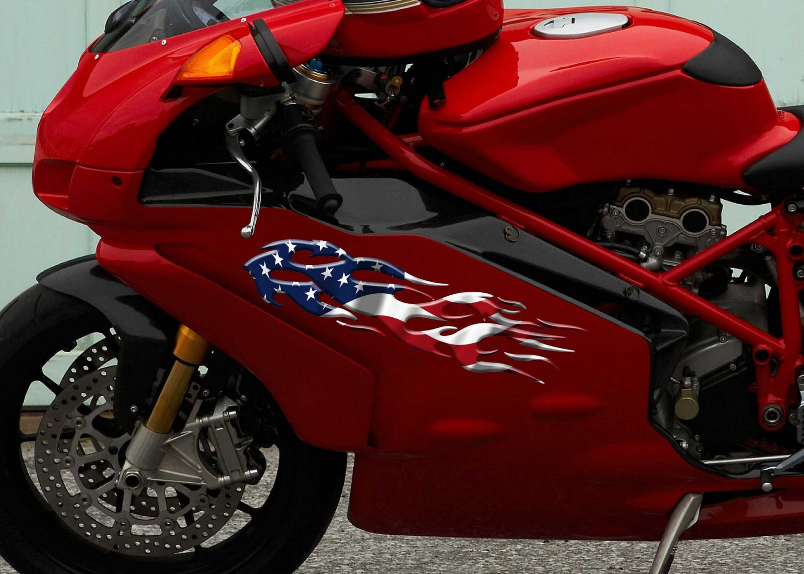 american flag flames decal on the side of red motorbike