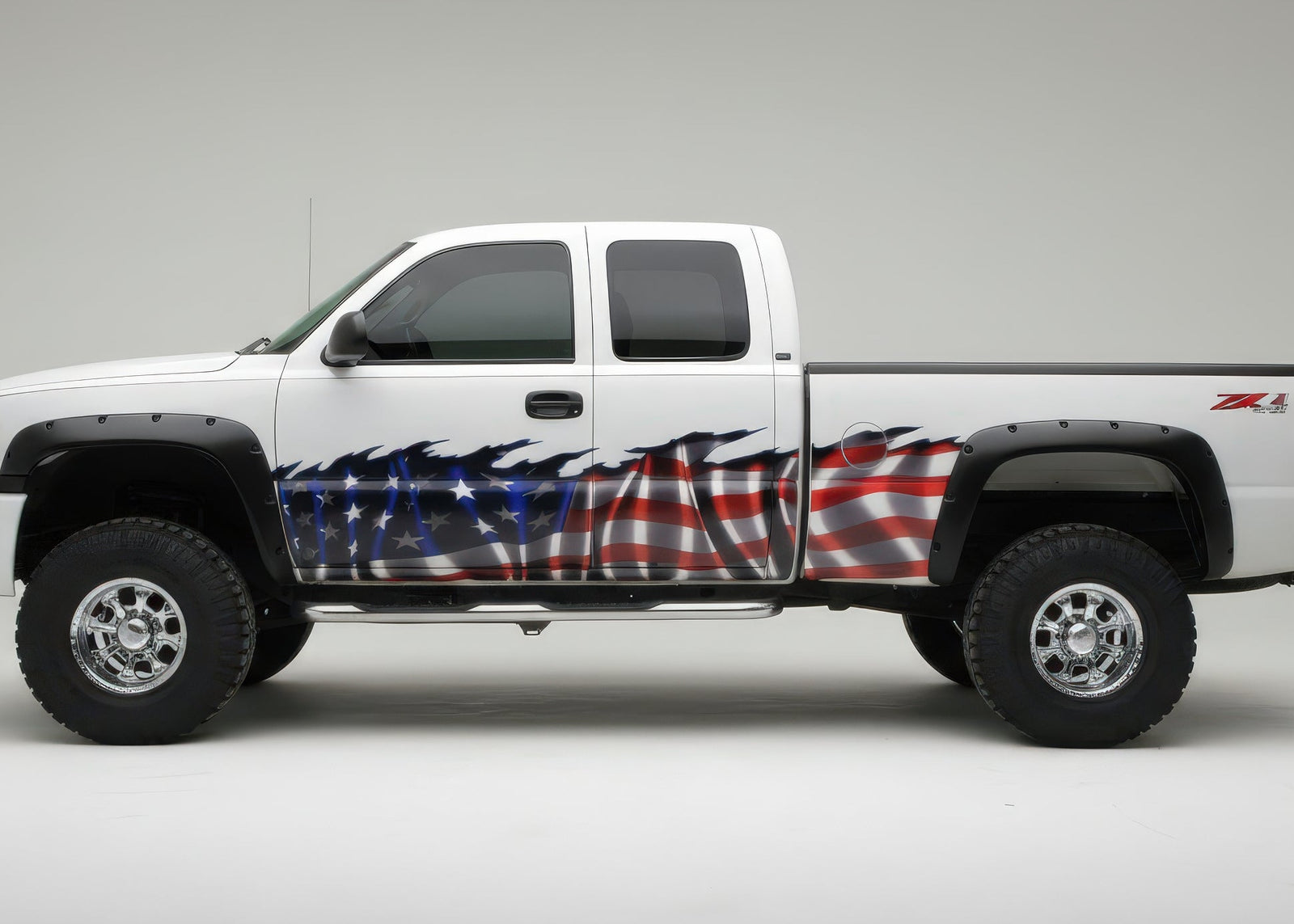 White pickup truck with American flag wrap on a gray background