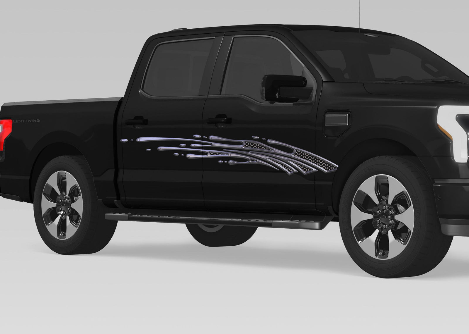 black pickup with metal style mud splash vinyl graphics on passenger side