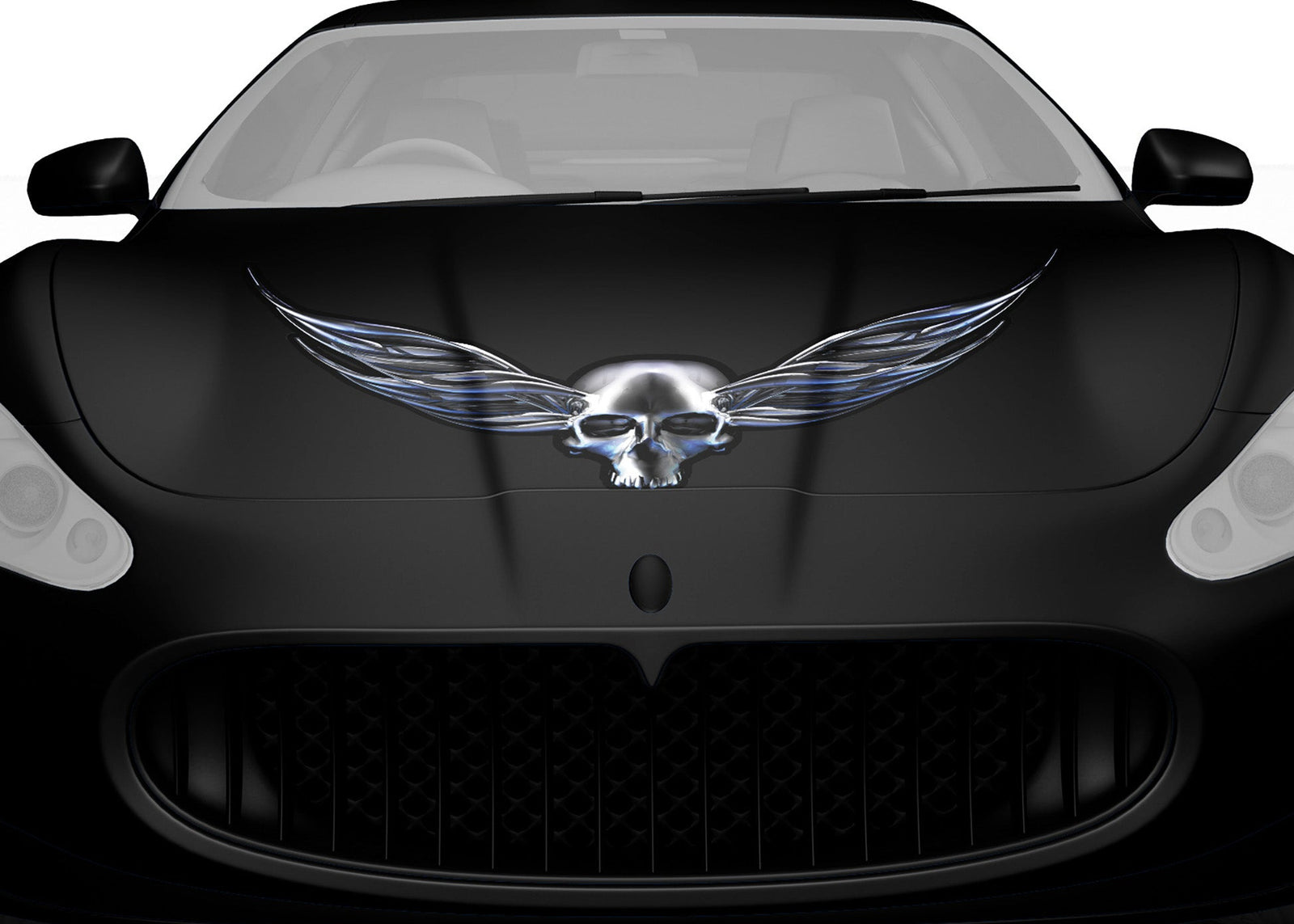 black sports car hood with chrome winged skull vinyl graphics on it
