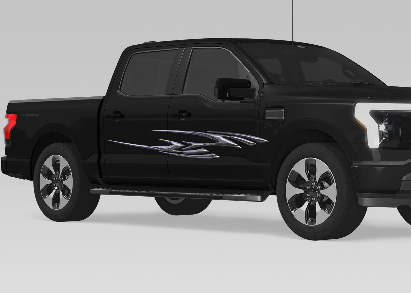 black truck with Aero Spike chrome vinyl decal on passenger side