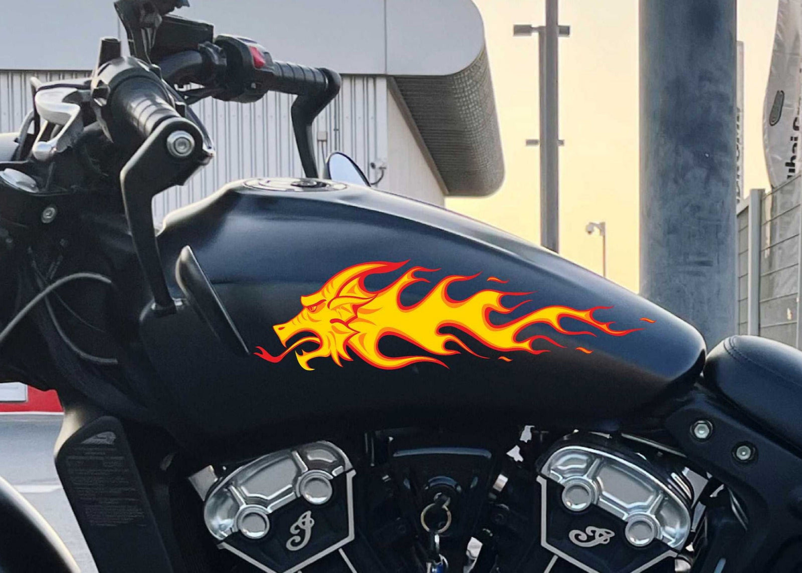 dragon flames decal on the gas tank of black motocycle