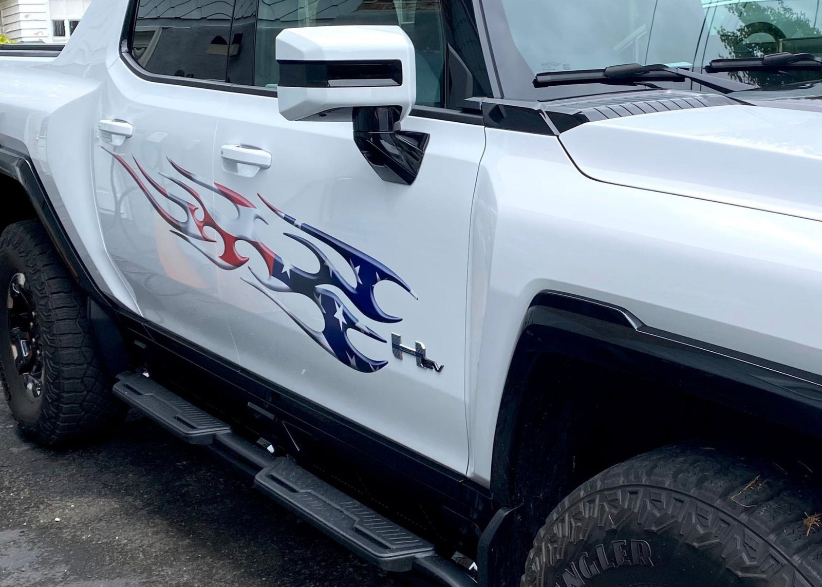 American flag Flames vinyl decal on the side of white Hummer EV