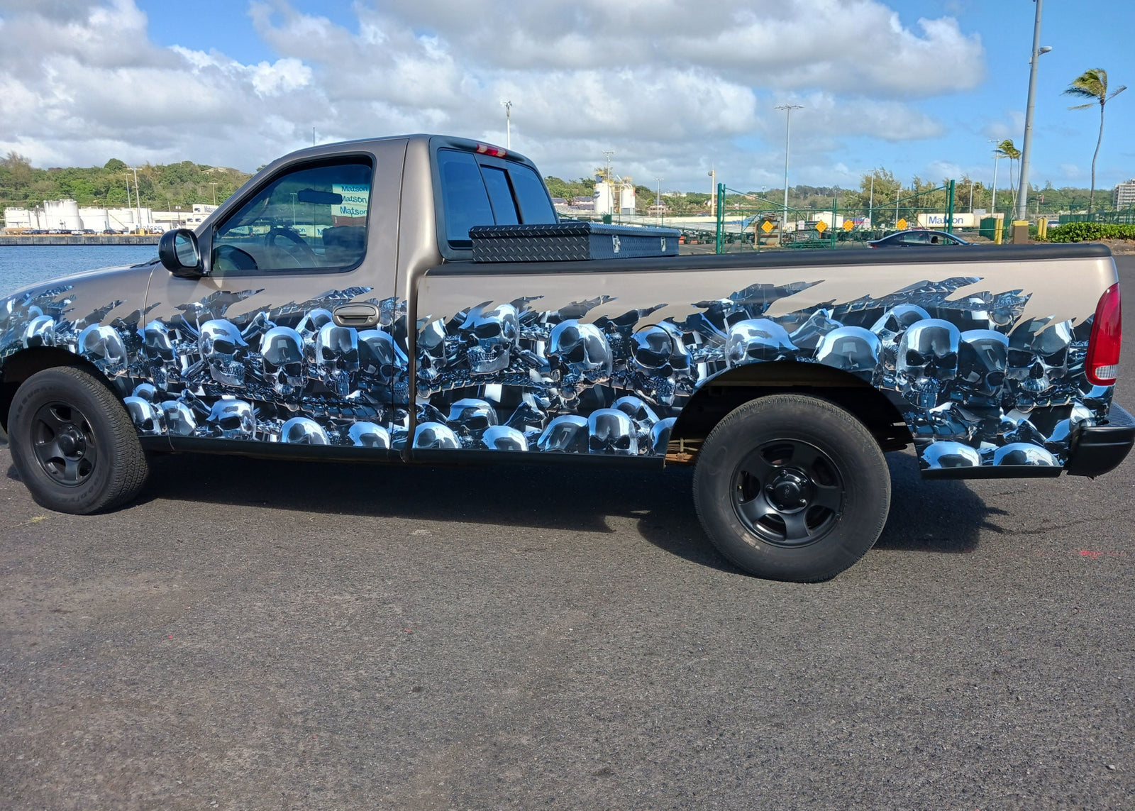 pickup truck with chrome skulls flames half wrap on driver side