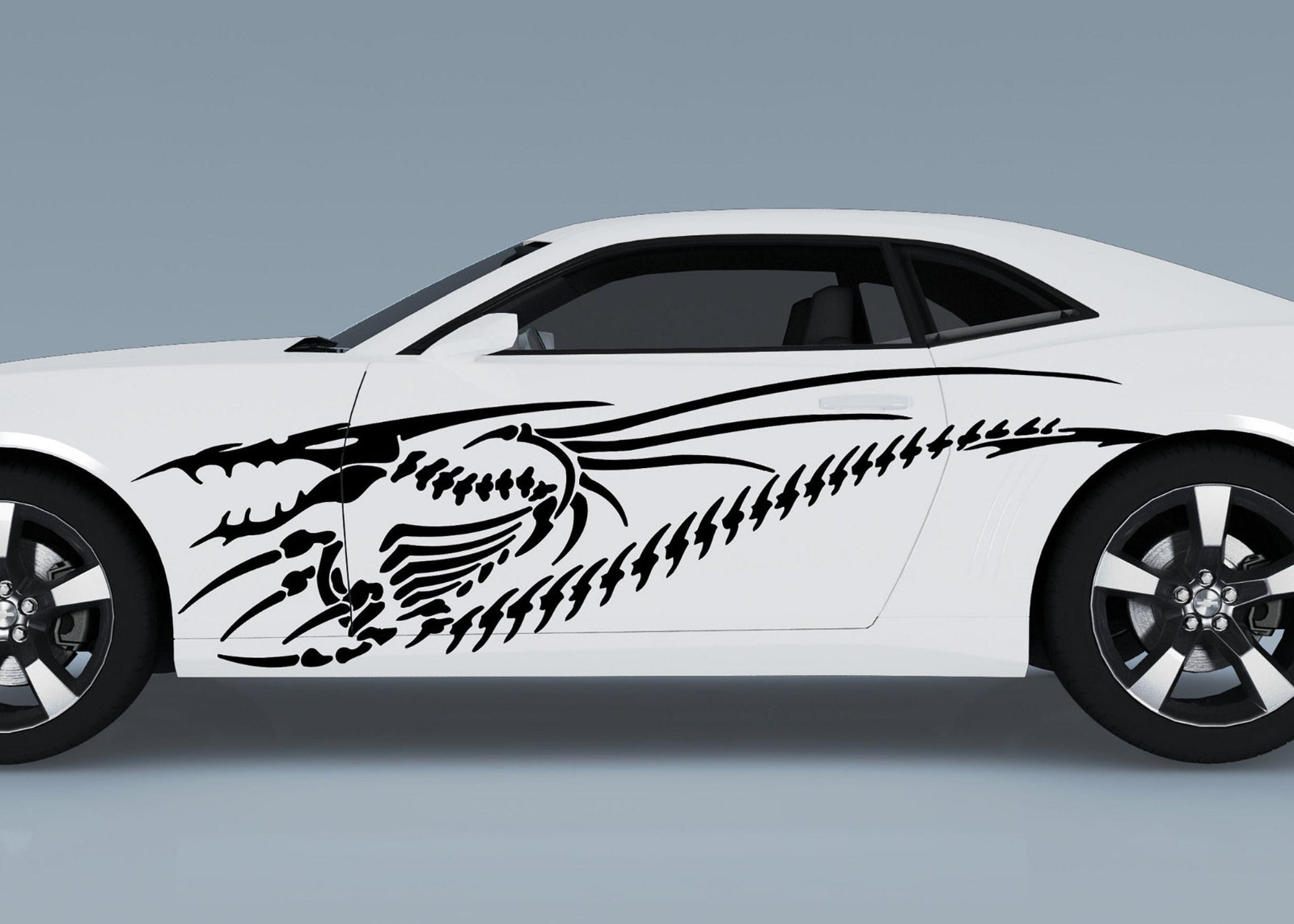 white sports car with black dragon skeleton vinyl decal on driver side
