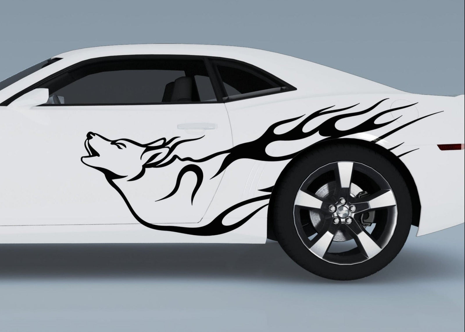 white sports car with howling wolf vinyl cut decal on driver side