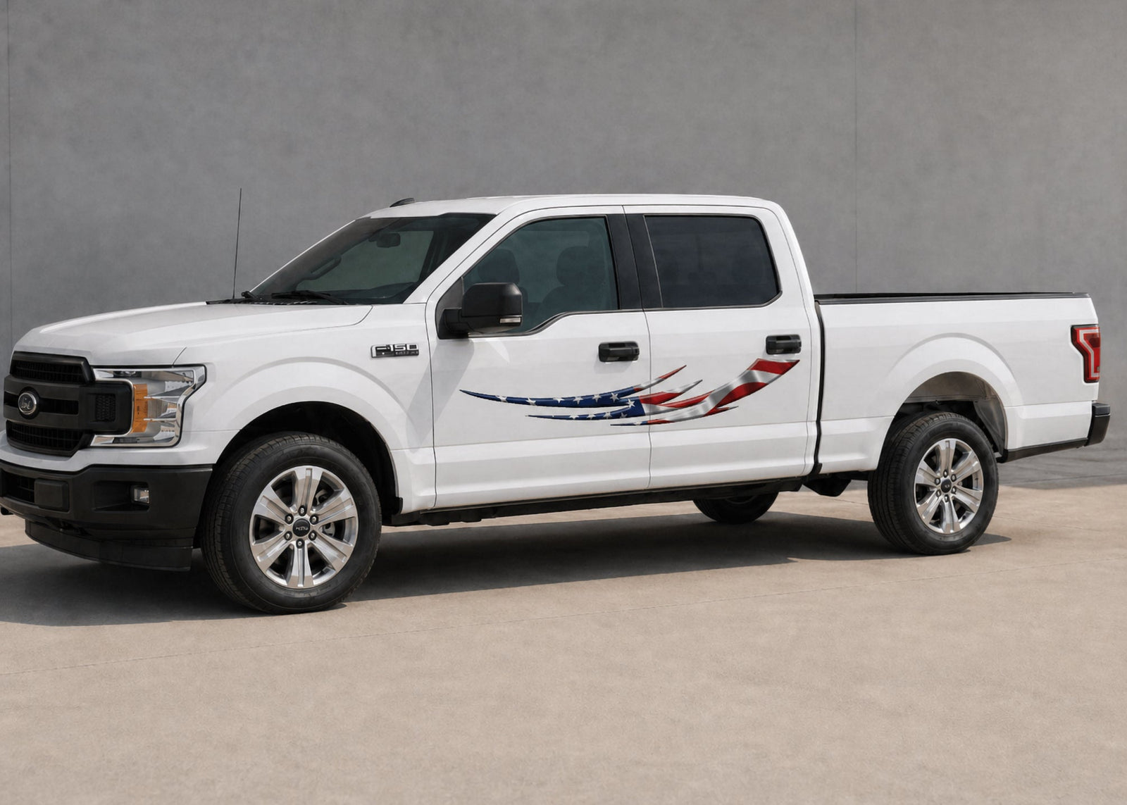 white truck with american flag tribal blade vinyl graphics on driver side