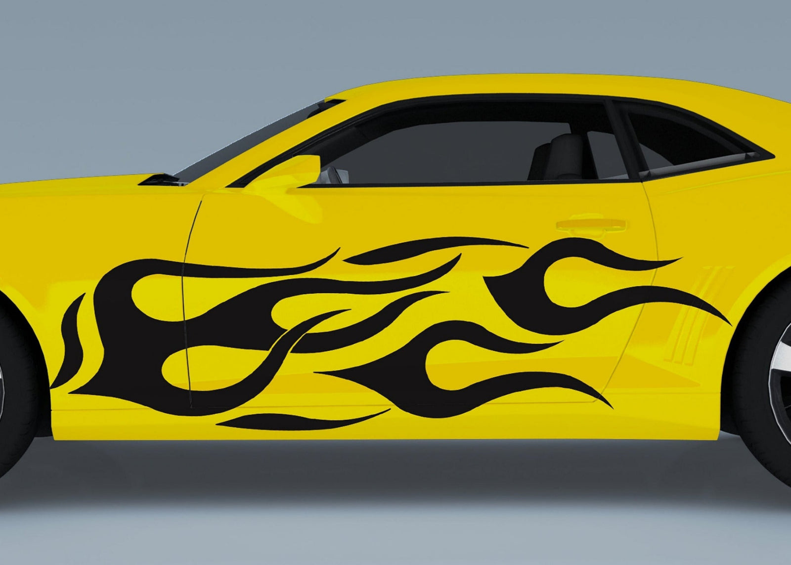 yellow camaro sports car with black vinyl flames decals on the side