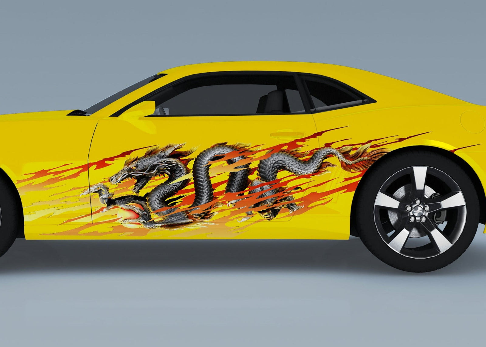 yellow camaro with dragon flame vinyl graphics on driver side