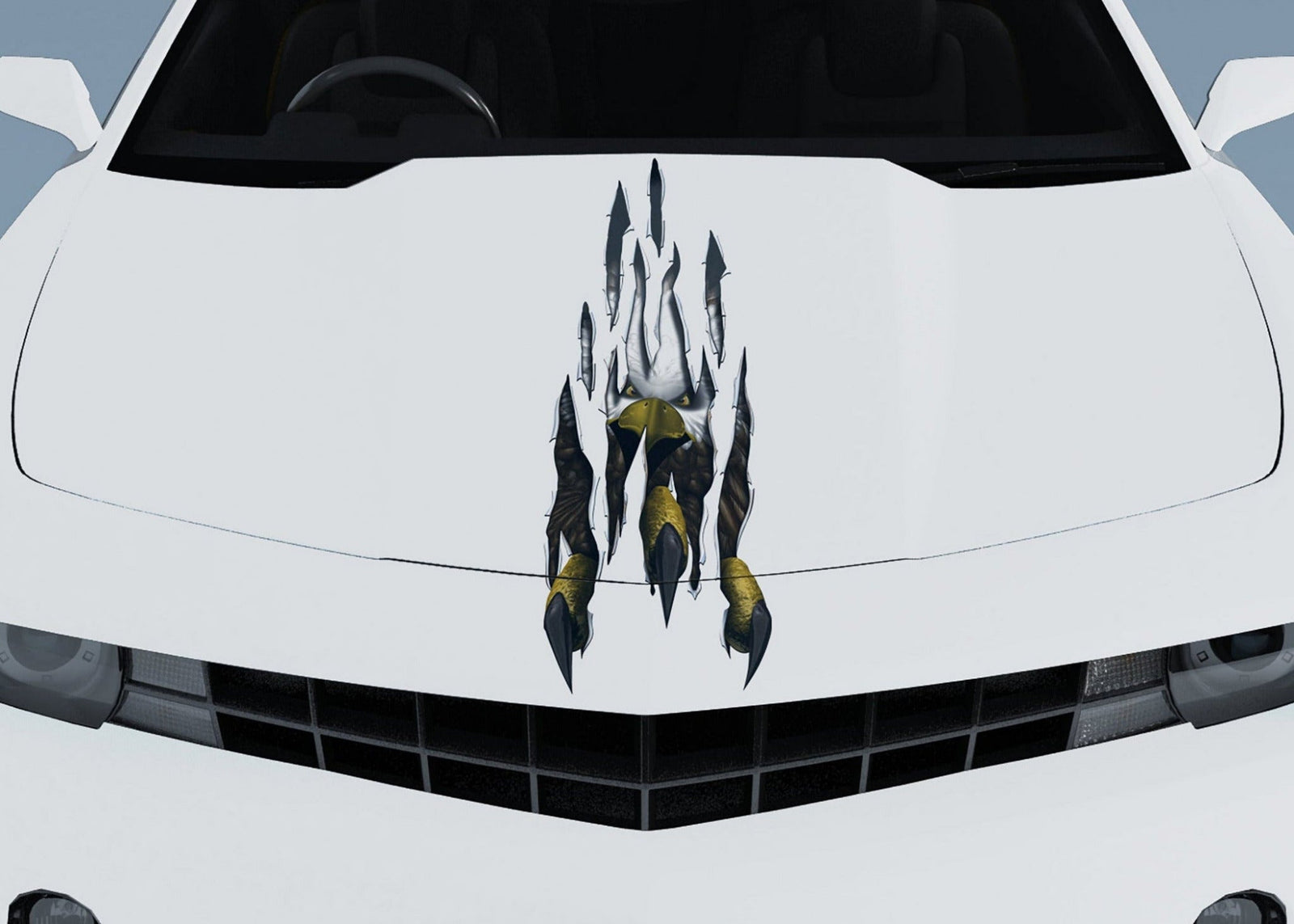 yellow camaro with eagle talon rip decal on the hood