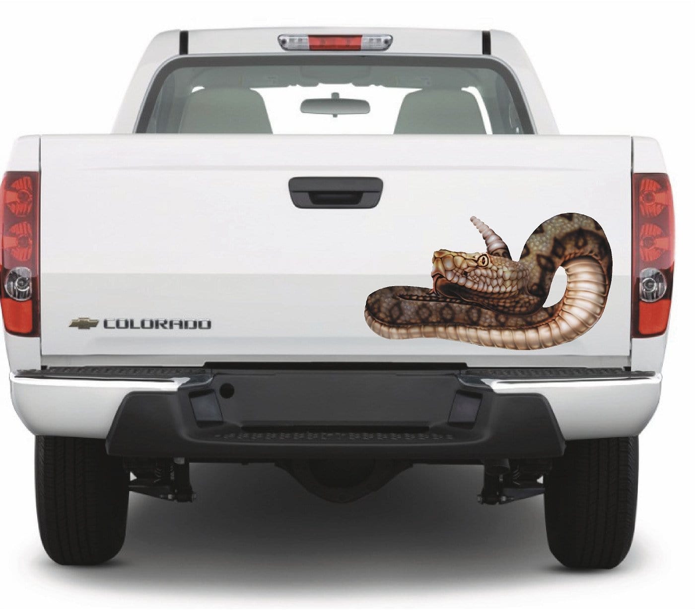Airbrushed rattlesnake vinyl decal on white pickup truck tailgate