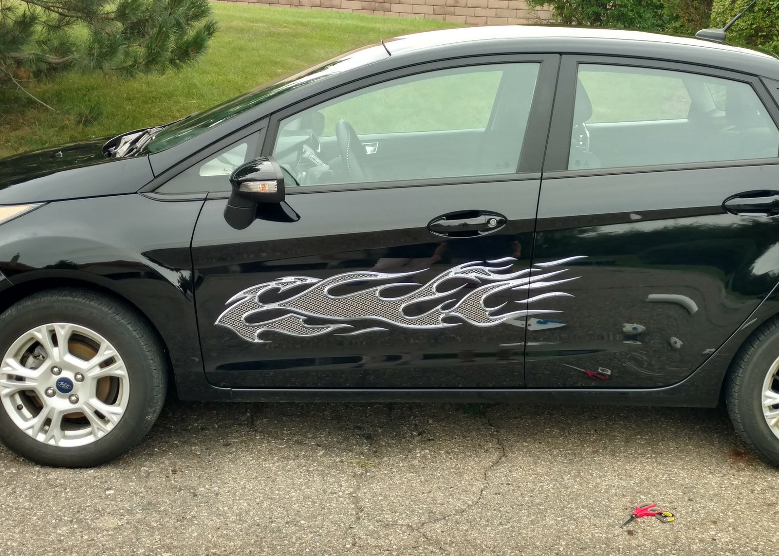 metal style flames vinyl graphics on black car driver side