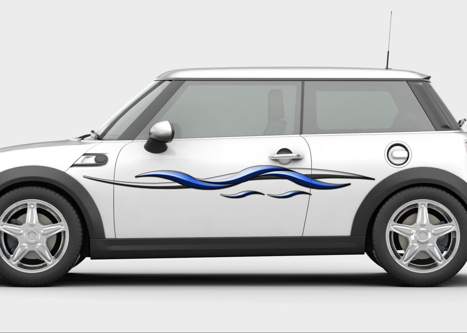 white mini cooper car with blue silver spear vinyl graphics on driver side