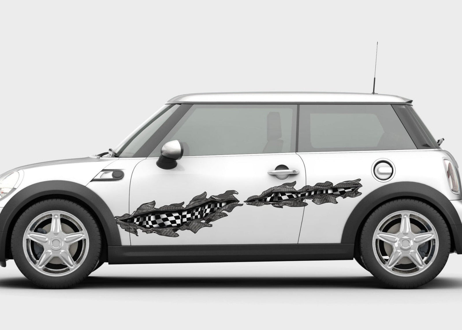 white mini cooper with checkered flag tears vinyl graphics on driver side