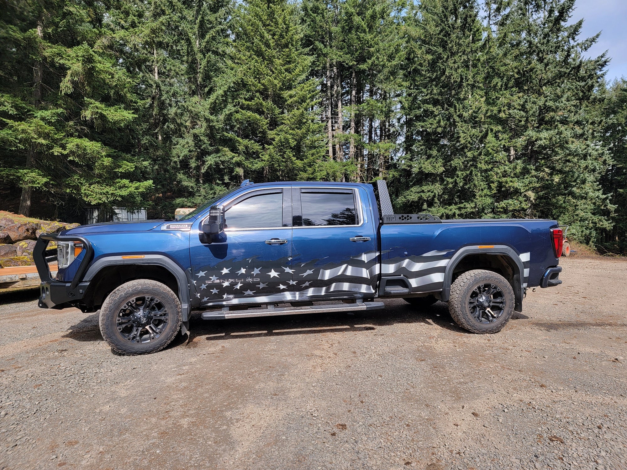 american flag half wrap on blue truck