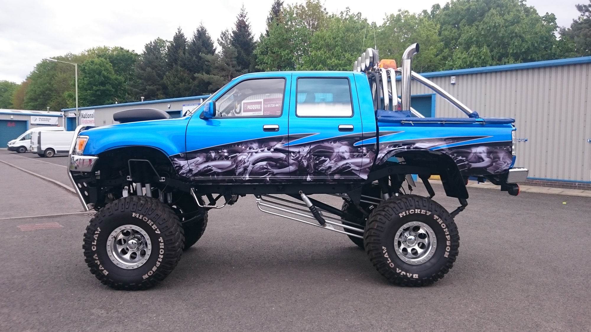 Dragons checkered flag wave half wrap on a Toyota Hilux monster truck