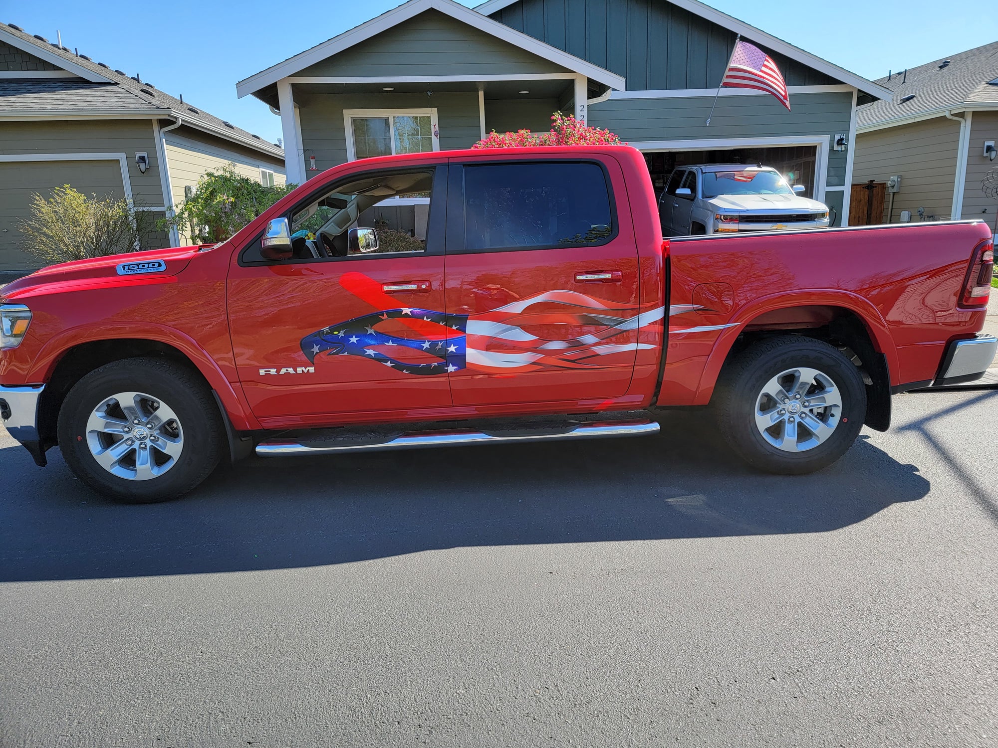 American eagle flames decal on side of red Dodge Ram pickup