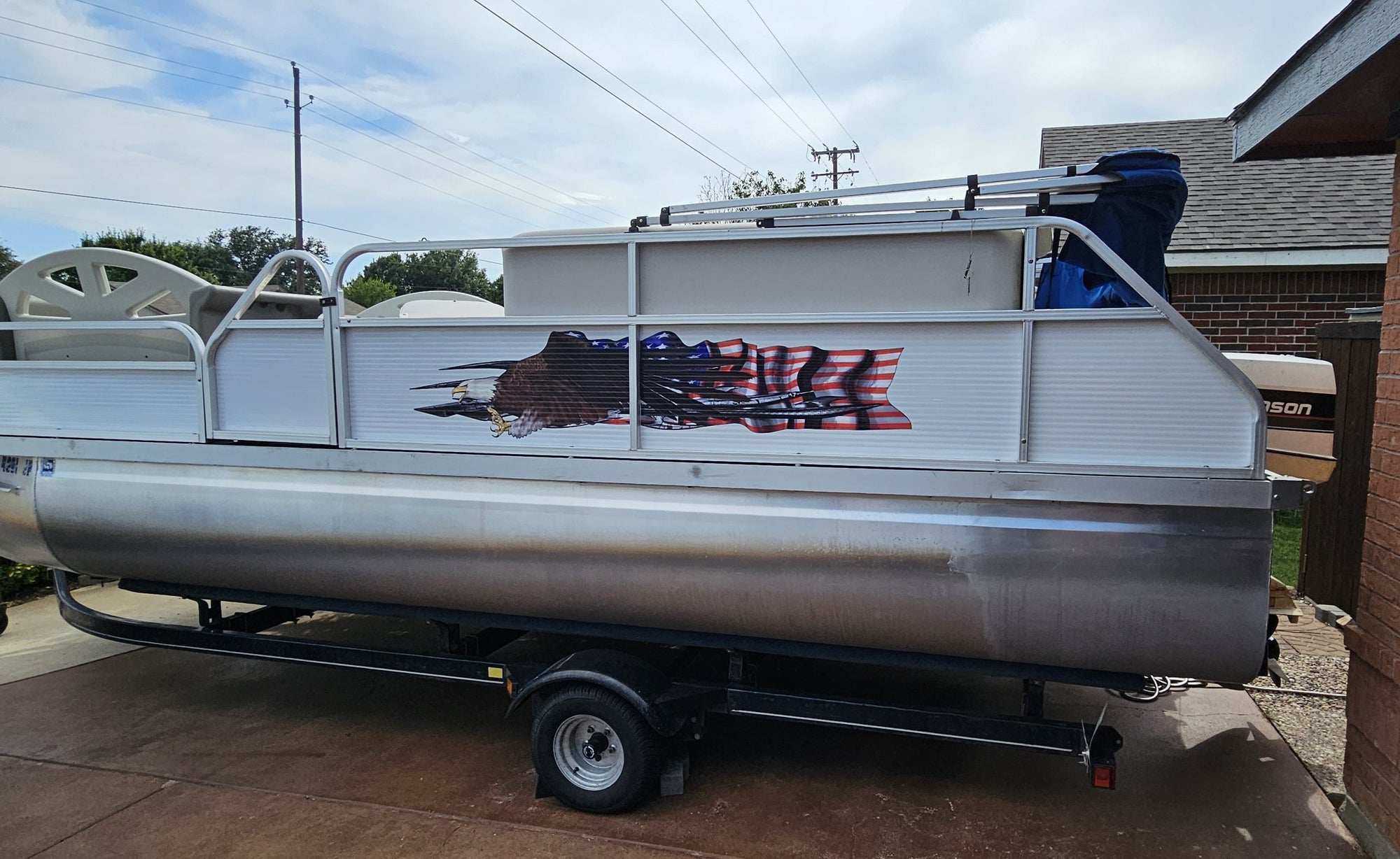 american flag bald eagle decal on the side of pantoon boat
