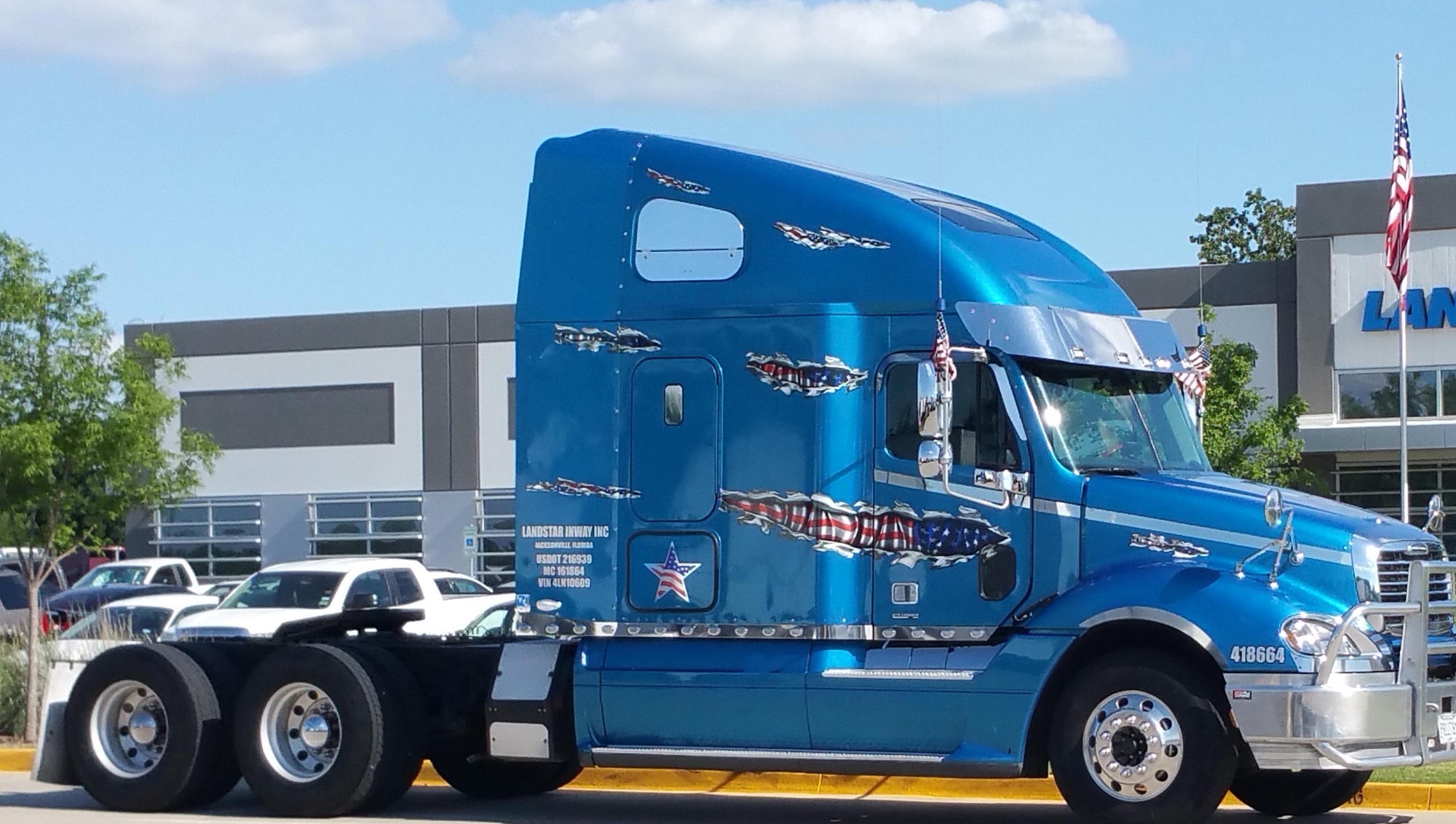 American flag decals on a blue semi truck