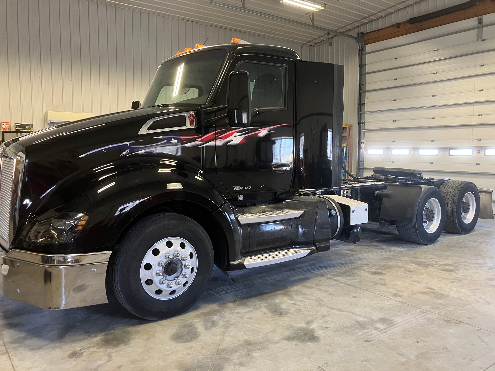 american flag flames vinyl graphics on black semi truck