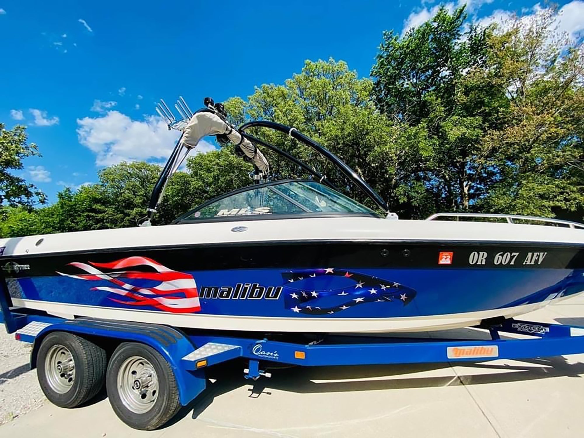 boat on trailer with american eagle flames decal on it side