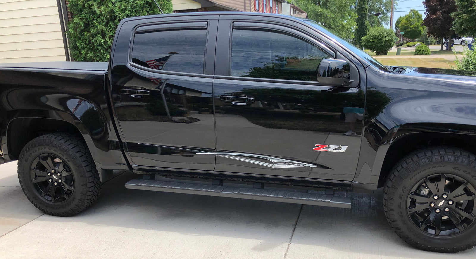 silver decal stripes on black z71 pickup truck