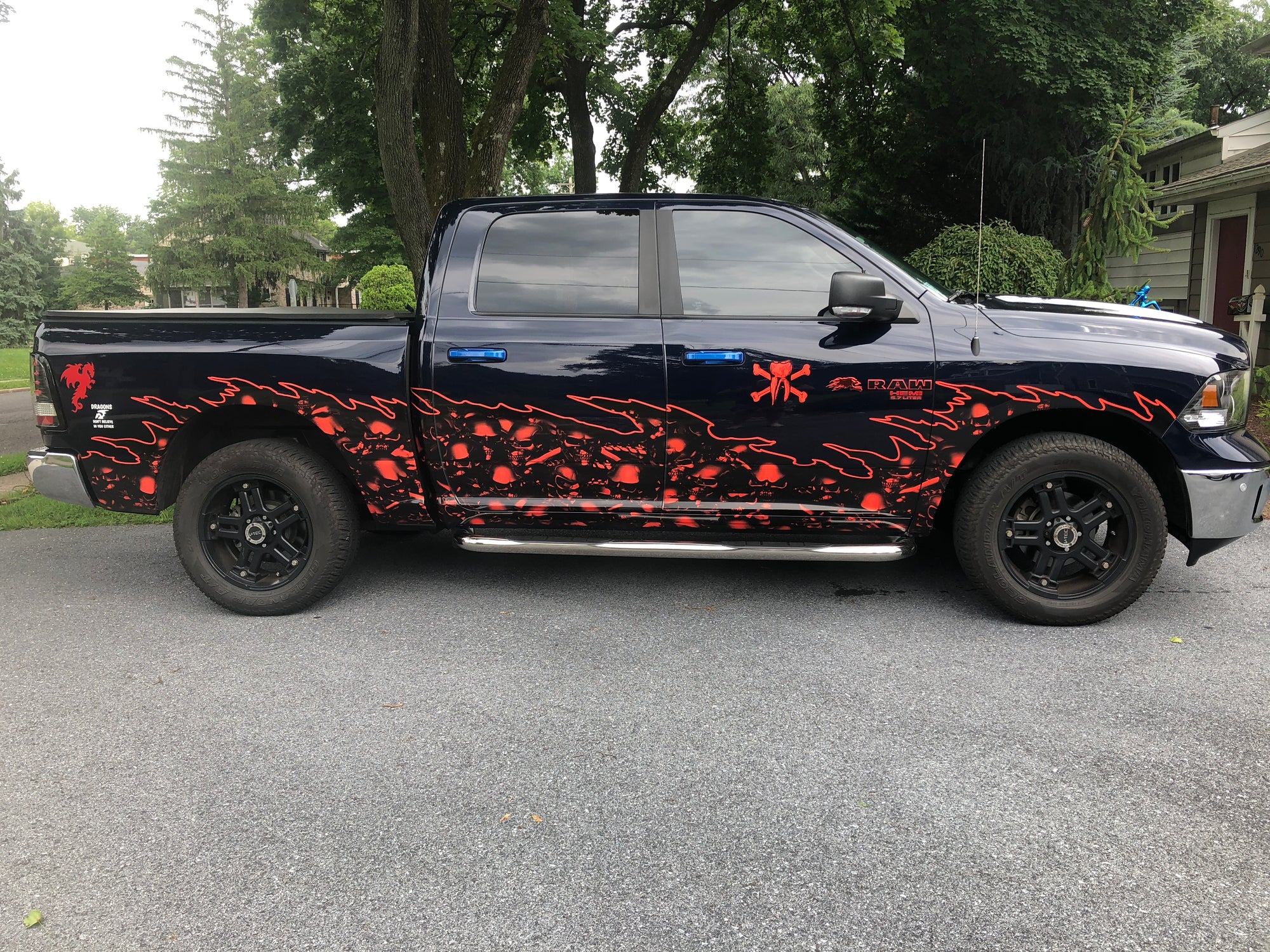 red skulls wave decal on the side of a black pick up truck