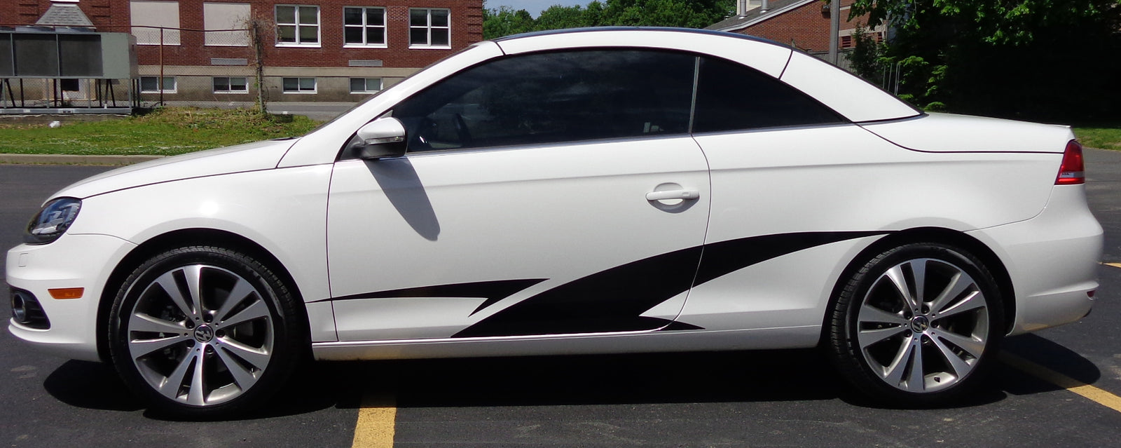 Black vinyl cut decal on a white car