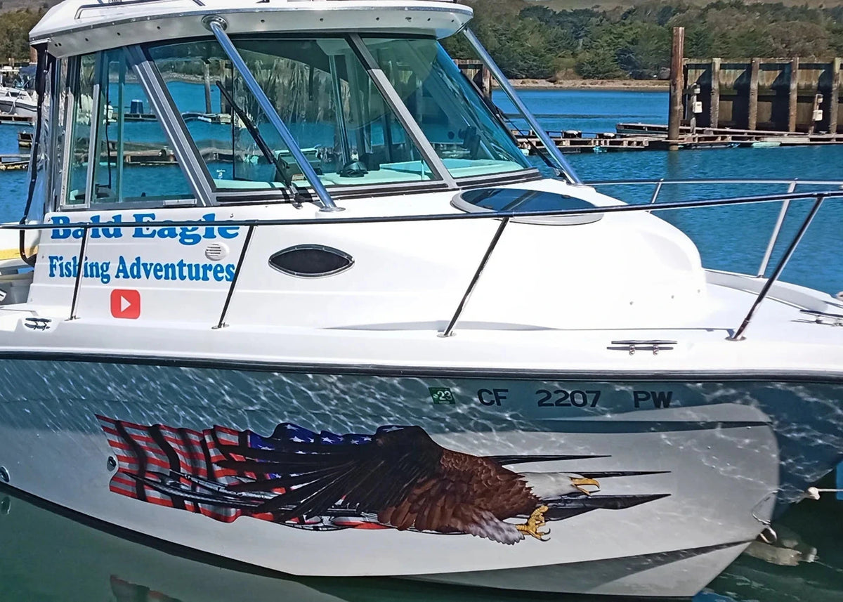 Boat with Bald Eagle American flag on a dock with water and trees in the background