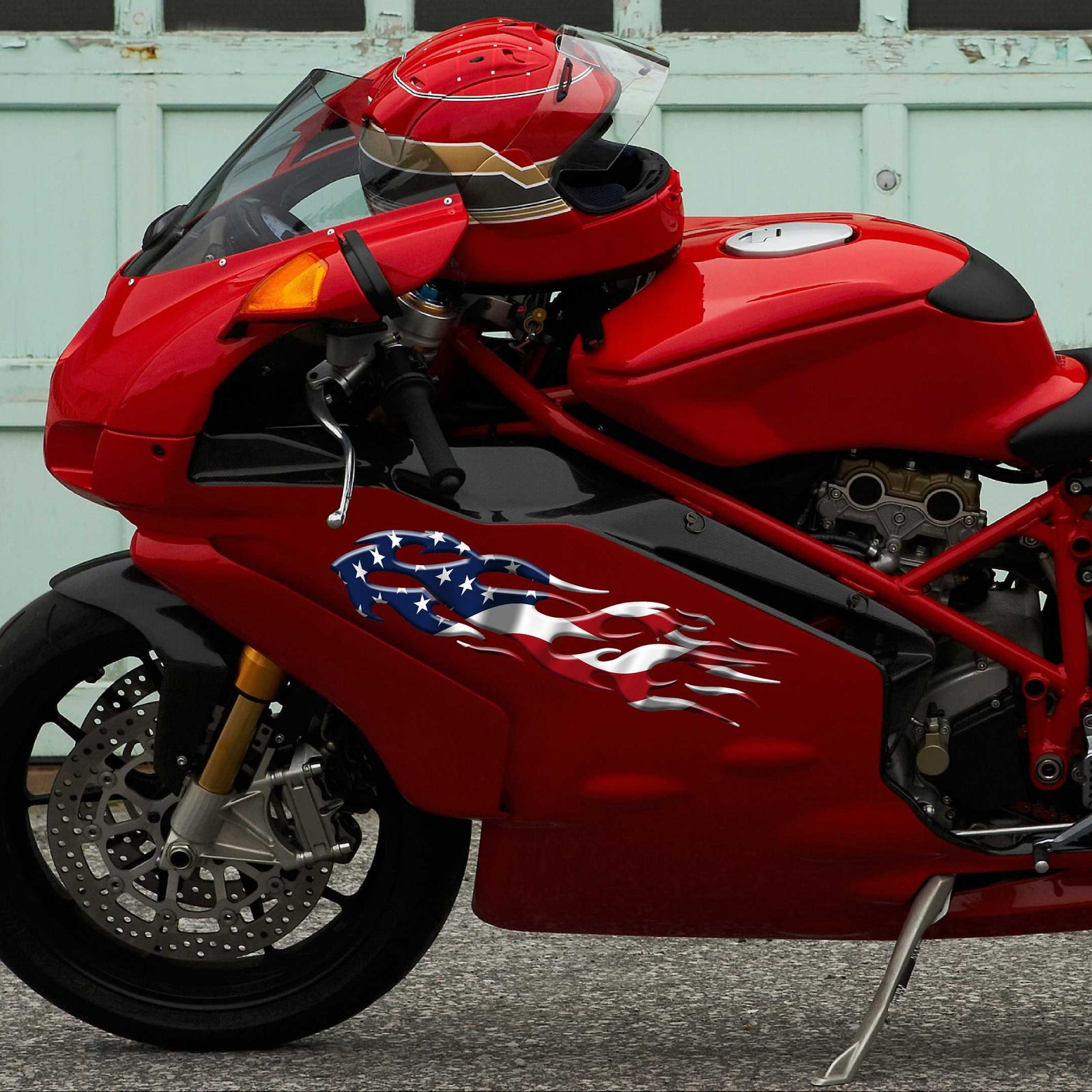 american flag flames decal on the side of red motorbike