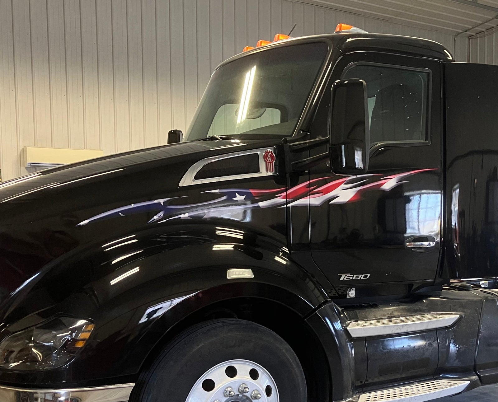 amerian flag flames graphics on the side of white truck