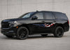 black chevy SUV with American flag Tribal blade vinyl decal on driver side