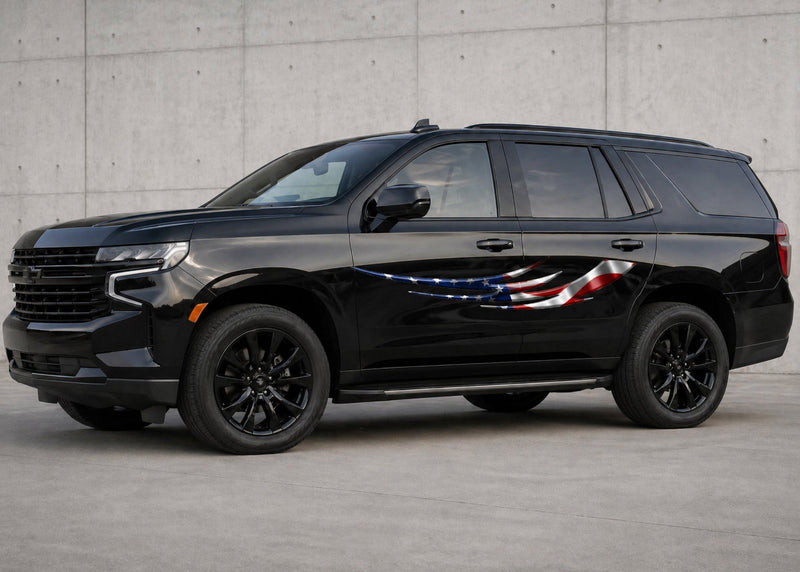 black chevy SUV with American flag Tribal blade vinyl decal on driver side