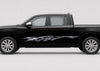 A black pickup truck shown in a side profile view against a light gray studio background. The truck features a chrome graphic decal on the side door.