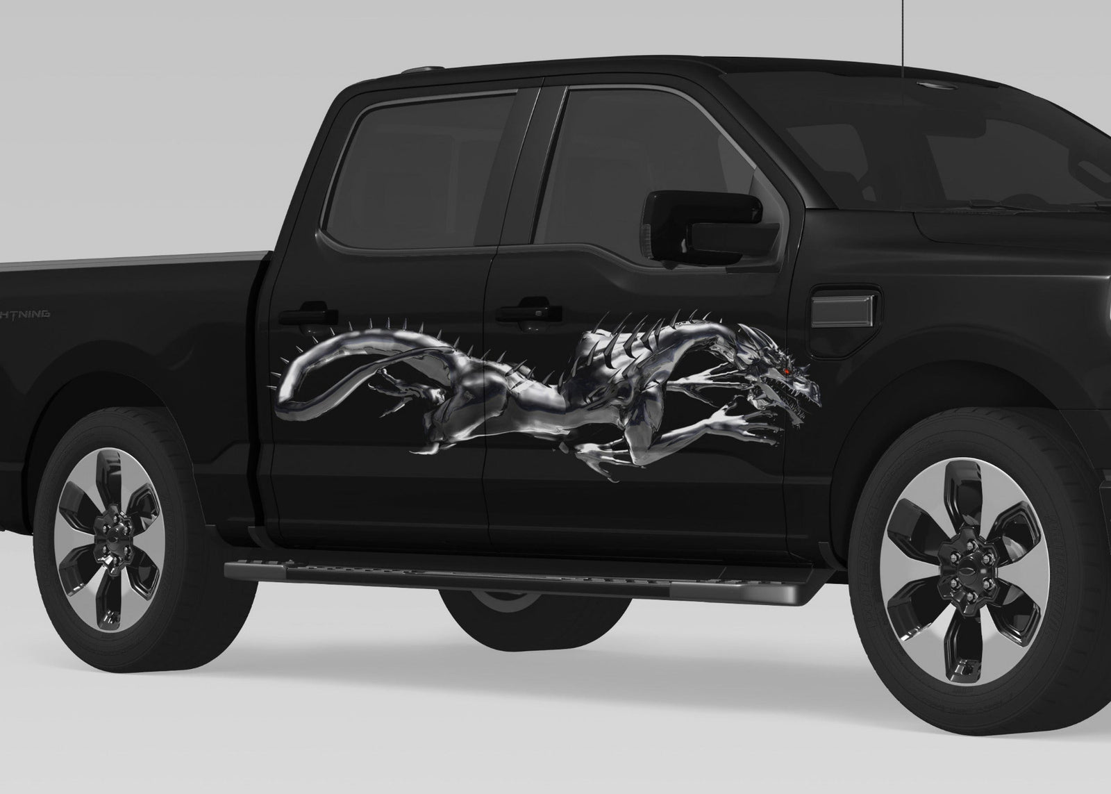 black pickup with Steel Dragon vinyl decal on passenger side