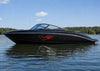 black speed boat sitting on water with red wolf flames vinyl cut graphics on hull