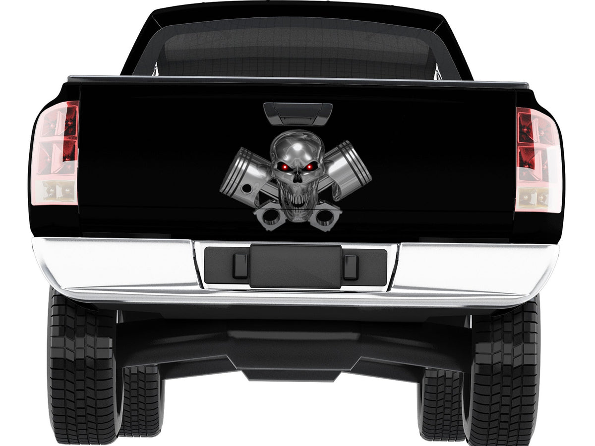 Chrome skull pistons tailgate decal centered on black pickup truck