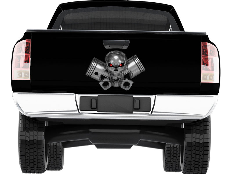 Chrome skull pistons tailgate decal centered on black pickup truck