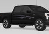 black truck with Grille Spear Stripe vinyl graphics on passenger side