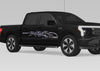 black truck with chrome mud splash vinyl graphics on passenger side
